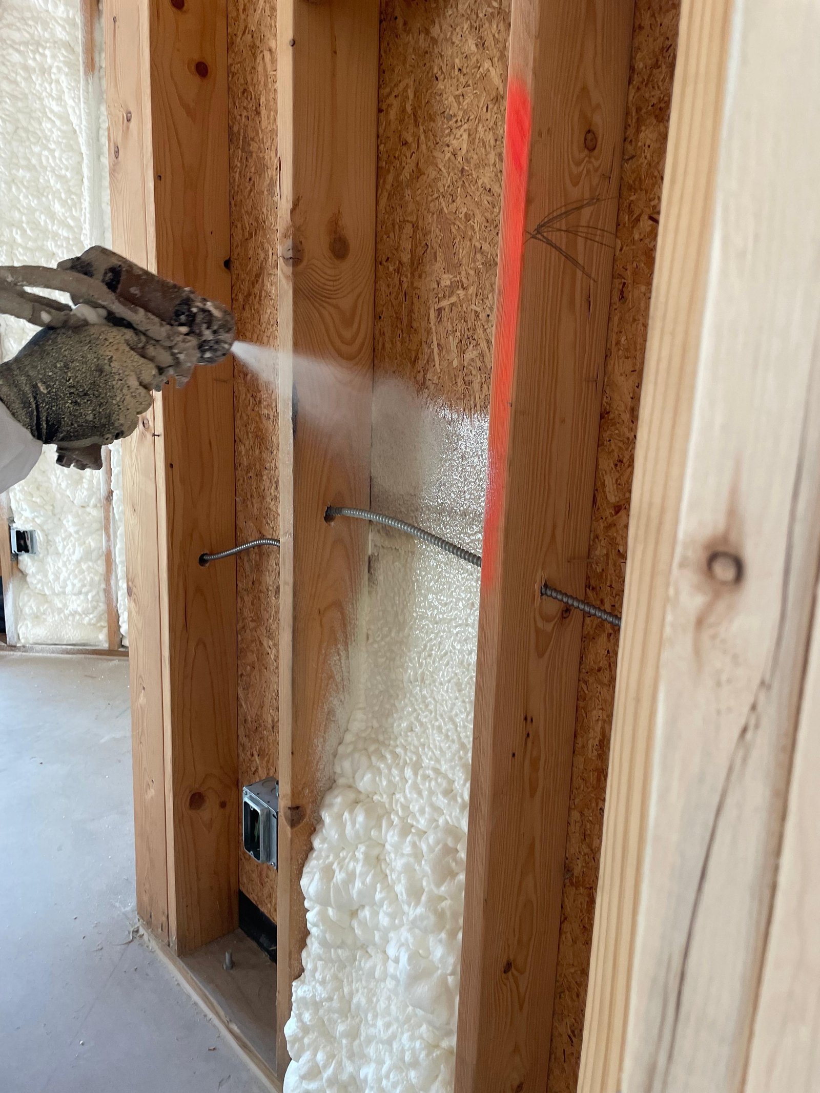 Batt insulation installed in wall cavity in San Antonio home